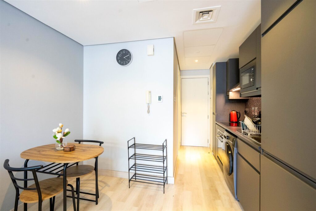 Dining and kitchen after the renovation, Lake View Tower, JLT