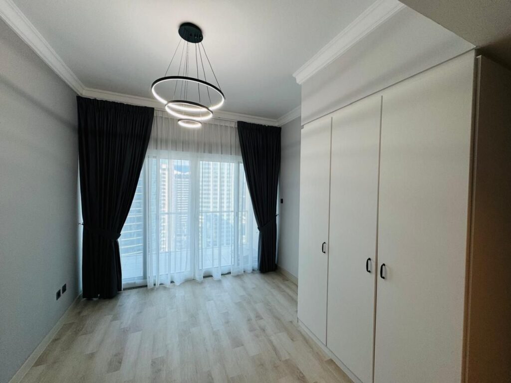 Wardrobes and window after the renovation, Lake View Tower, JLT